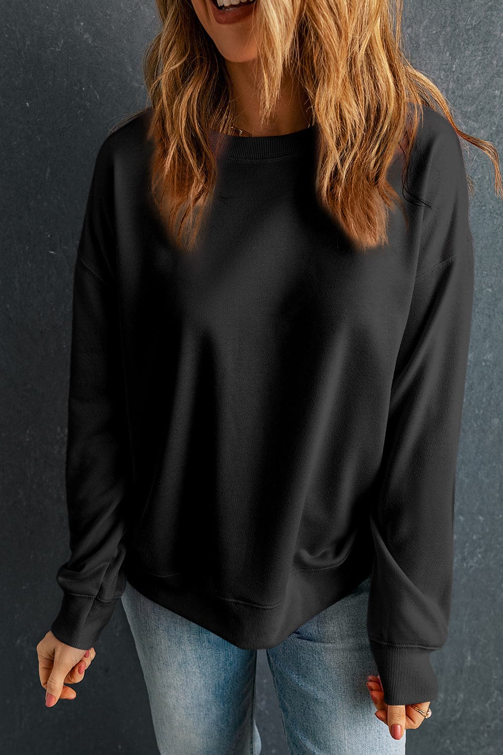 Round Neck Dropped Shoulder Sweatshirt.