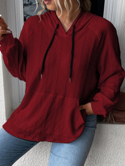 Cozy pocketed sheer hoodie with drawstring and long sleeves