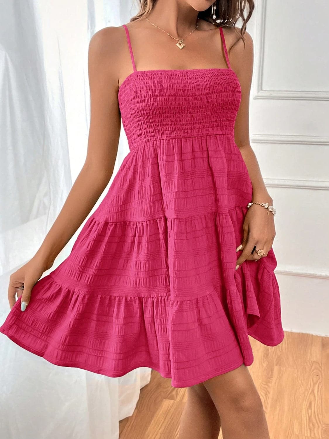 Smocked Tiered Sleeveless Mini Dress.