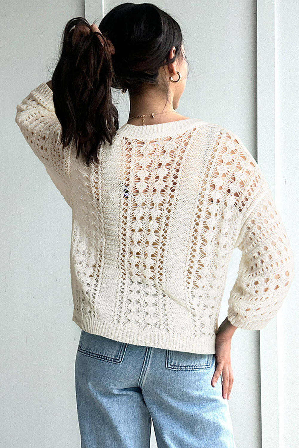 Chic White Knit Sweater with Hollow-Out Bracelet Sleeves and Drop Shoulder Design