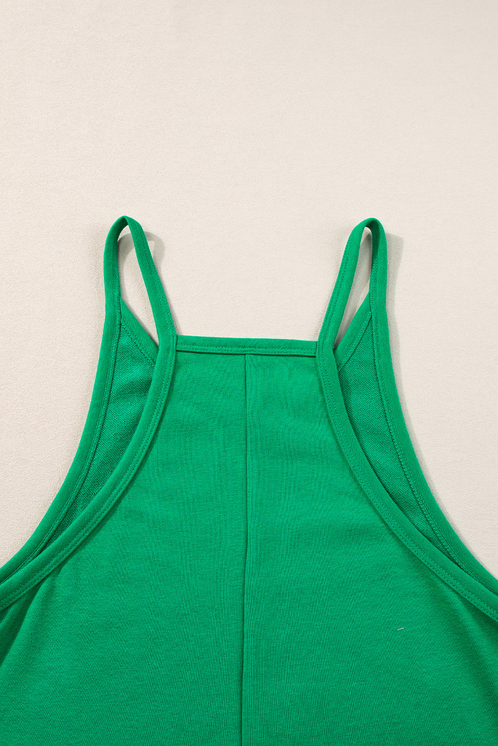 Vibrant green sleeveless v-neck romper with pockets