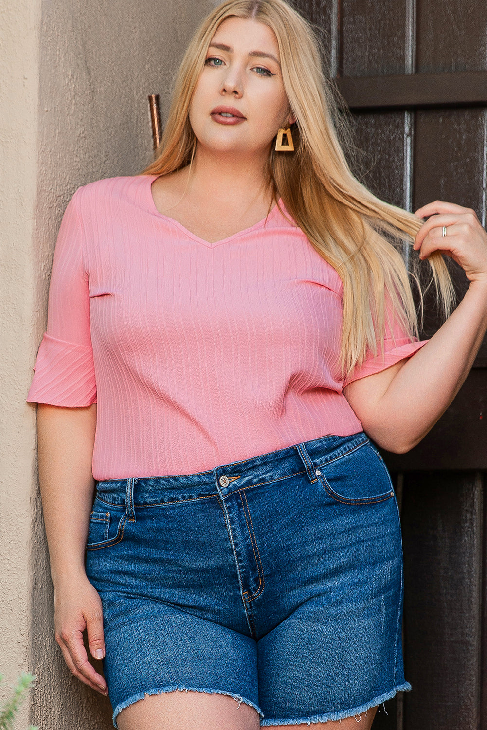 Peach blossom textured plus top with ruffled sleeves and V-neck