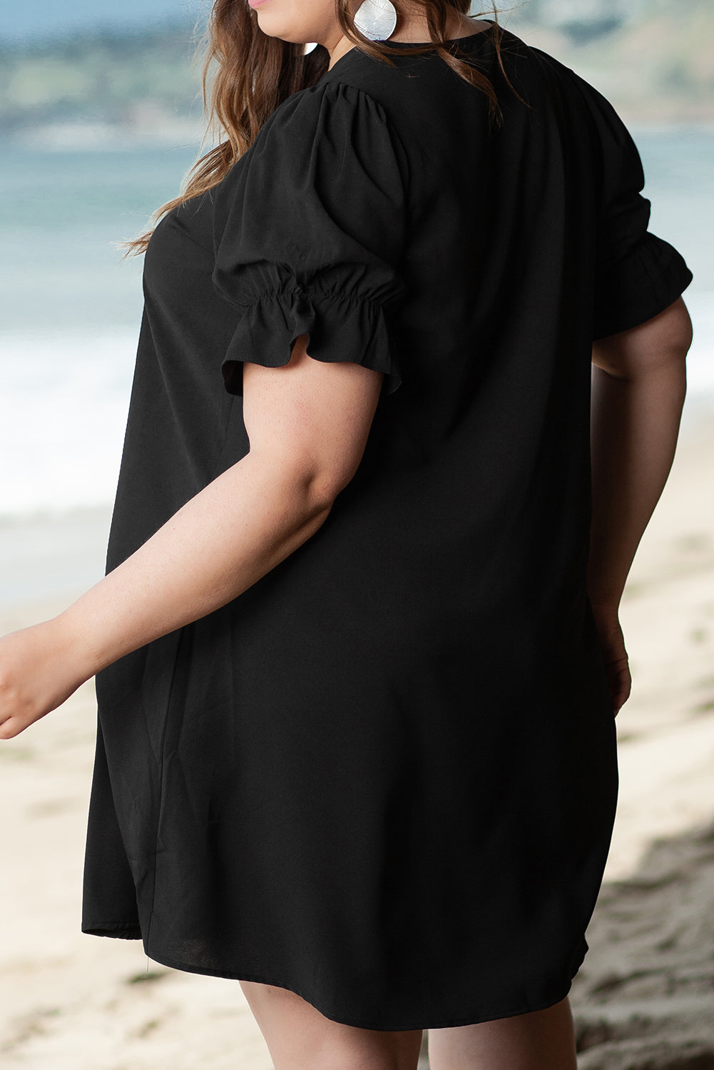 Elegant black ruffled mini dress with puff sleeves for plus sizes