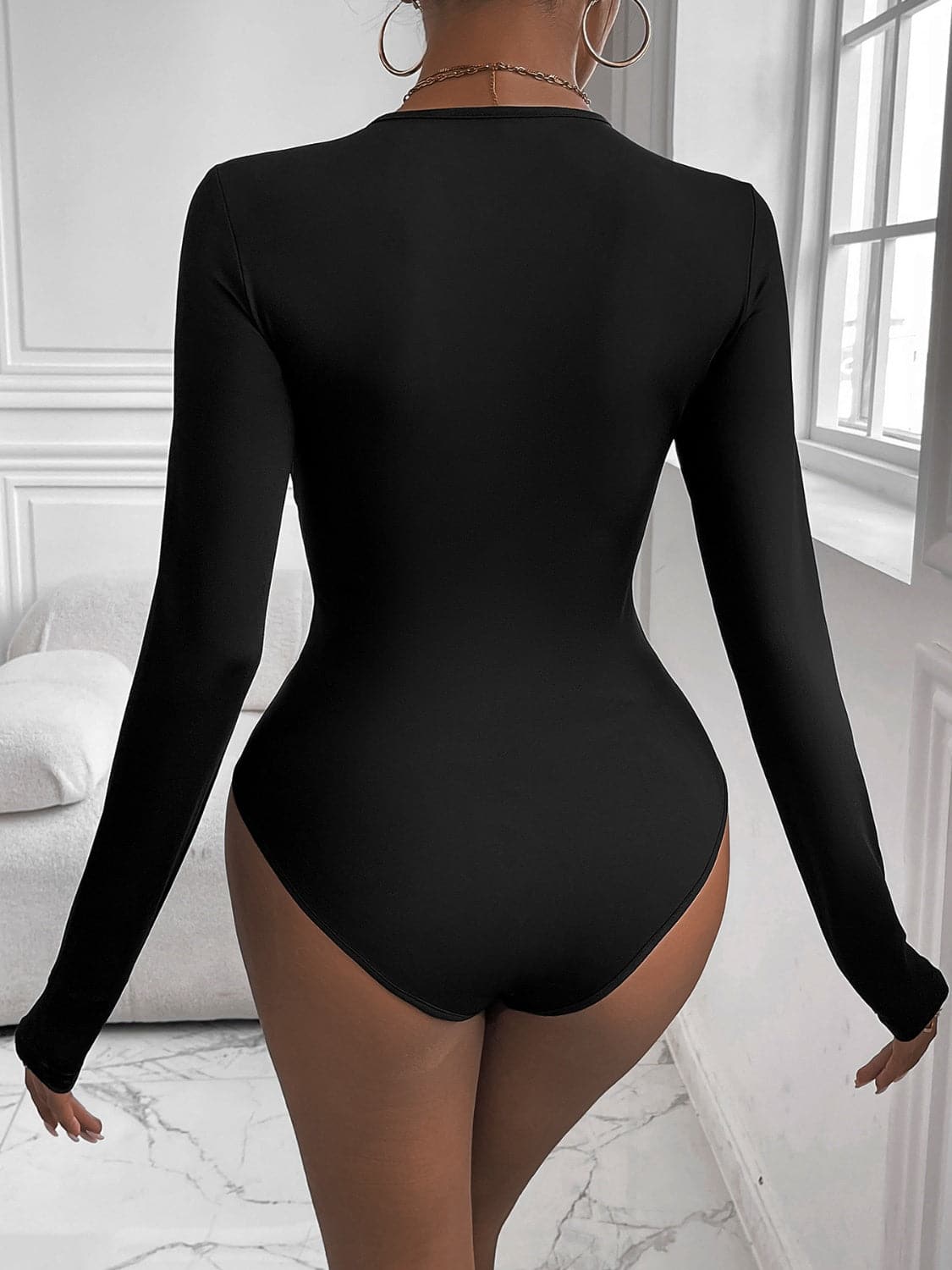 Twisted Round Neck Long Sleeve Bodysuit.