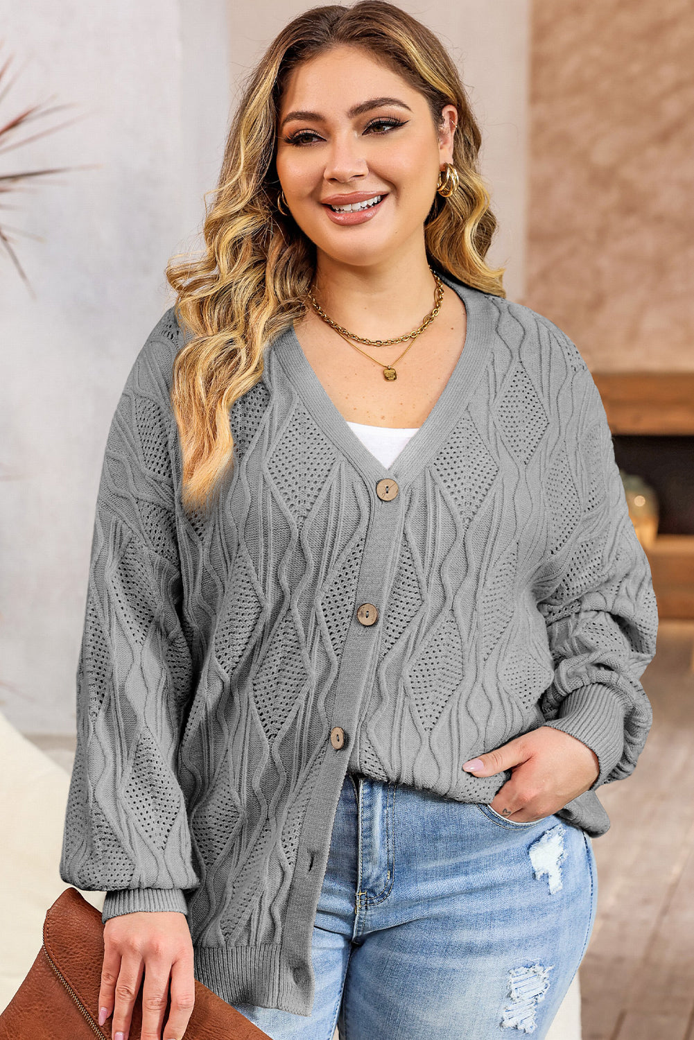 Chic gray plus size knitted cardigan with hollow-out details and button front