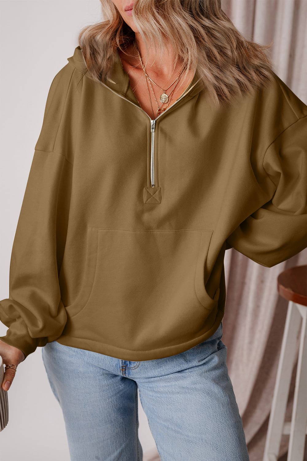 Pocketed Half Zip Dropped Shoulder Hoodie.