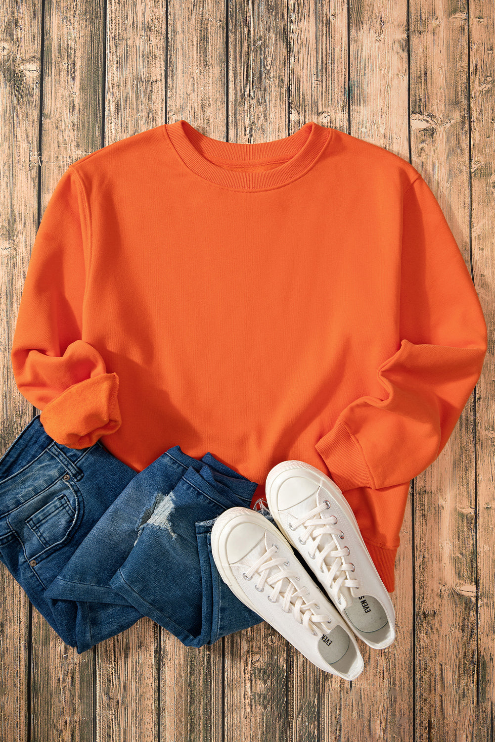 Cozy russet orange fleece-lined sweatshirt with drop shoulders