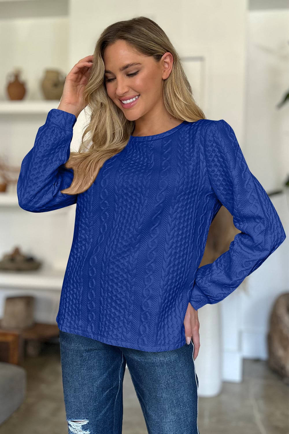 Textured Round Neck Long Sleeve Sweatshirt.