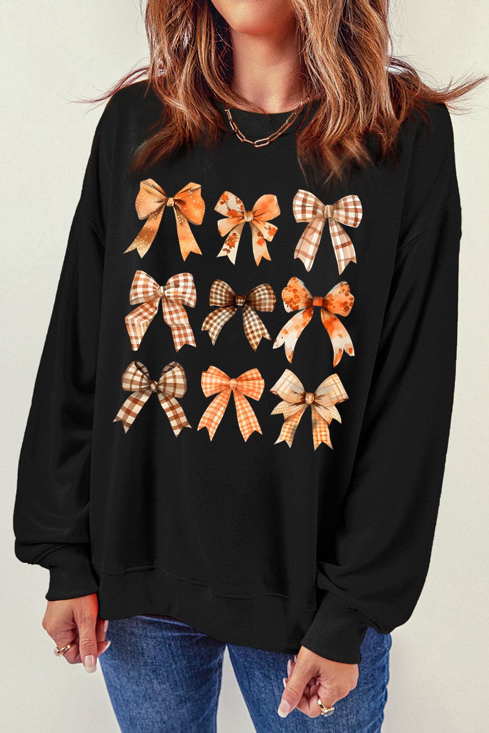 Bow Graphic Round Neck Long Sleeve Sweatshirt.