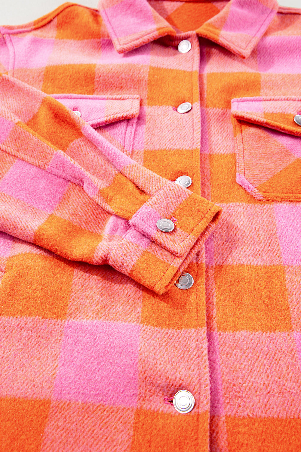 Orange plaid button-up jacket with chest pockets and turn-down collar