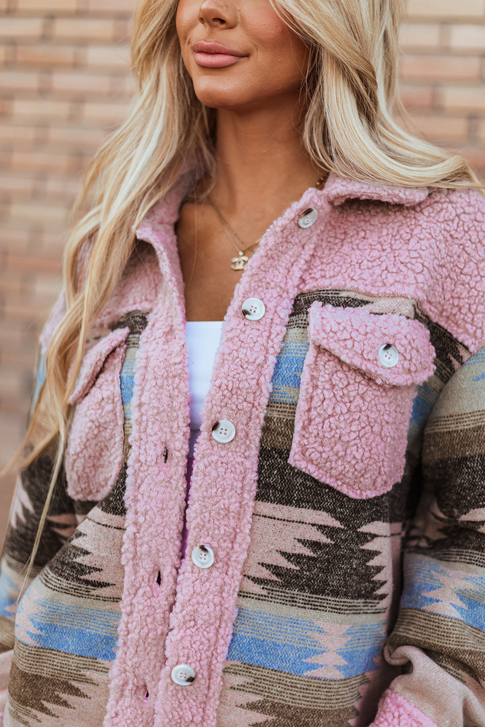 Cozy pink Aztec print sherpa coat with flap pockets