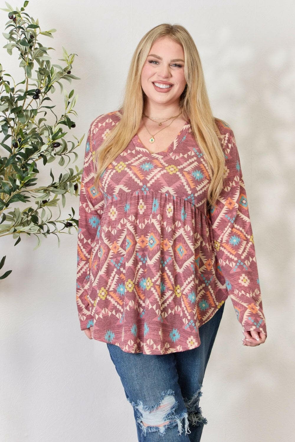 Heimish Full Size Geometric V-Neck Babydoll Top.