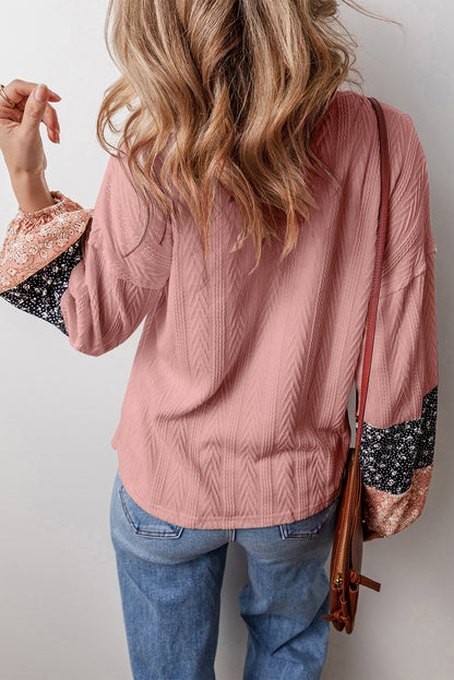 Dusty pink floral patchwork v-neck blouse with textured knit and drawstring detail