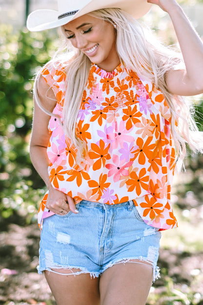 Floral delight: Orange ruffled sleeve top with smocked detail