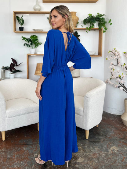 Double Take Full Size Surplice Wide Leg Jumpsuit with Pockets.