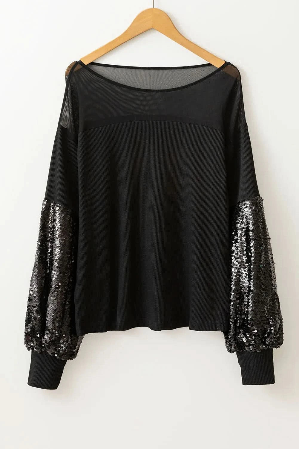 Glamorous sequined boat neck blouse with long sleeves