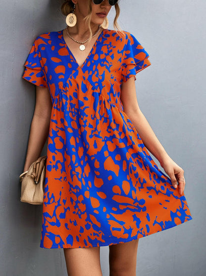 Ruffled Printed V-Neck Short Sleeve Mini DressUpgrade Your Wardrobe with our Ruffled Printed V-Neck Short Sleeve Mini Dress
 Step out in style with our stunning Ruffled Printed V-Neck Short Sleeve Mini Dress. ElLove Salve -Neck Short Sleeve Mini Dress