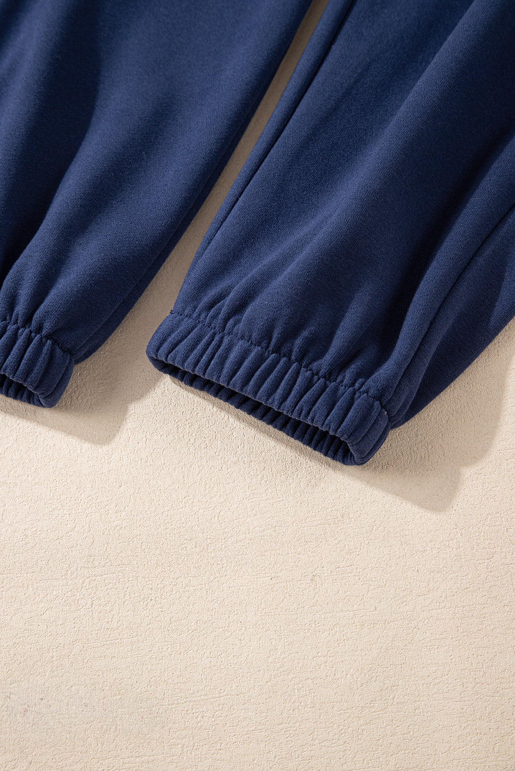 Navy blue fleece joggers with drawstring