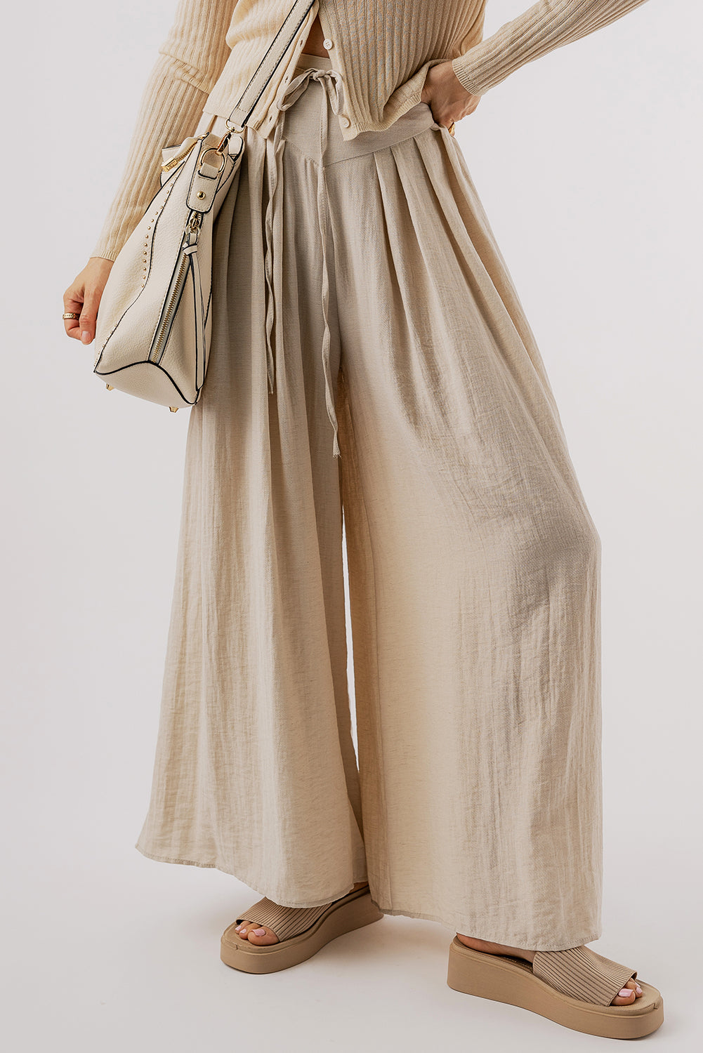 Beige high-waisted wide-leg trousers