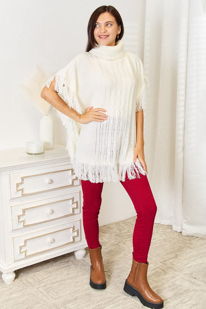 Justin Taylor Turtle Neck Fringe Poncho.