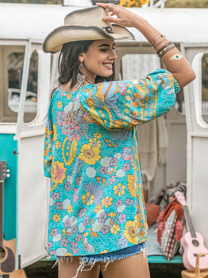 Printed Tie Neck Half Sleeve Blouse.