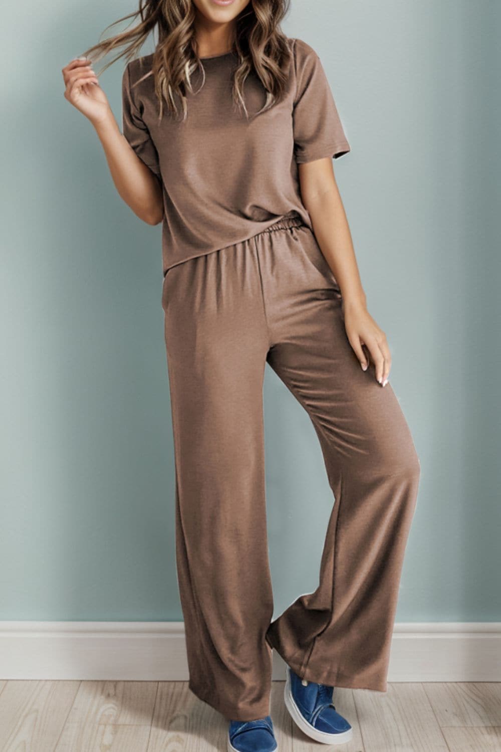 Two-piece stretch top and pants set in brown, perfect for comfort and style.