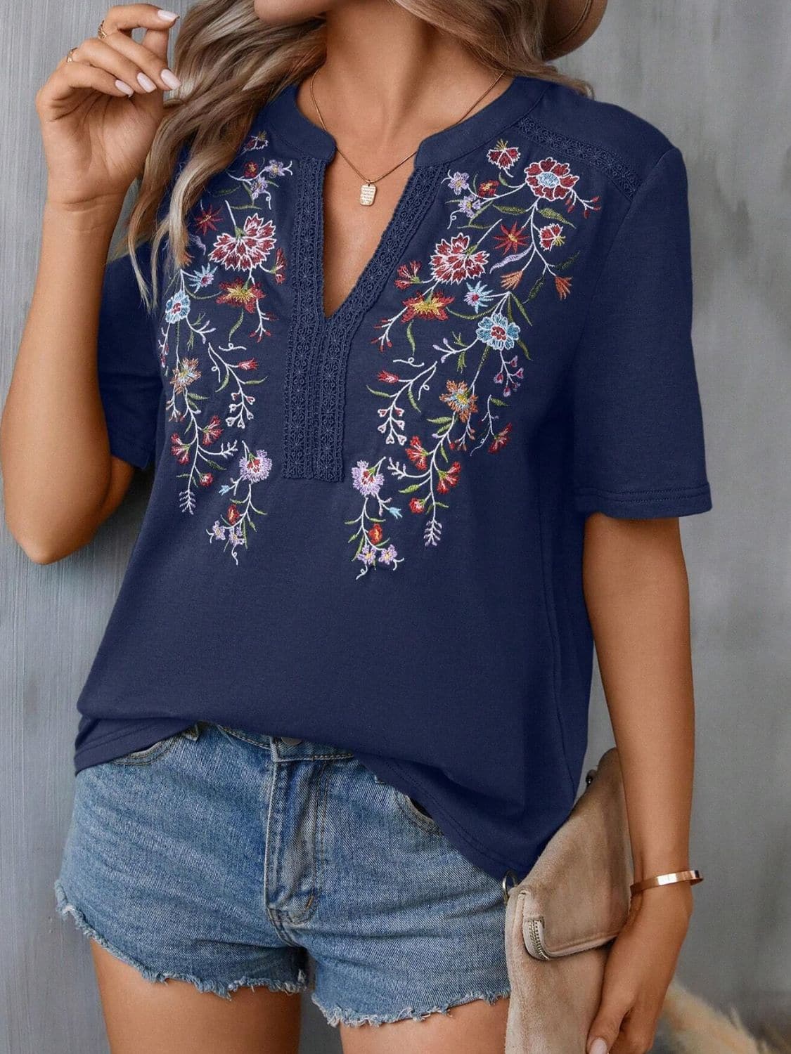 Embroidered Notched Short Sleeve T-Shirt.