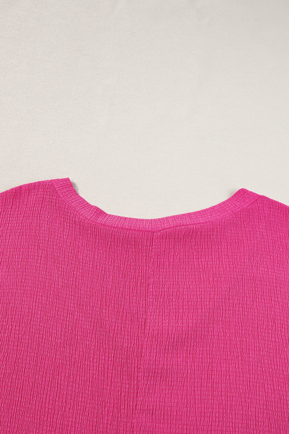 Vibrant pink textured bubble hem top for plus sizes