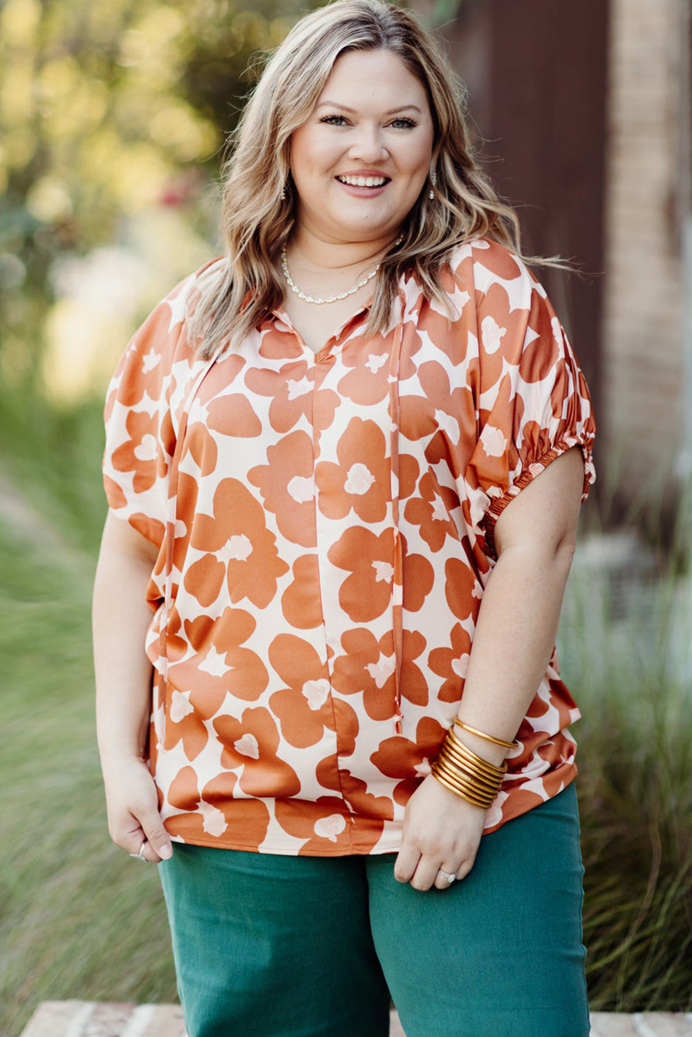 Floral Delight: Plus Size Orange V Neck Blouse with Drawstring Detail