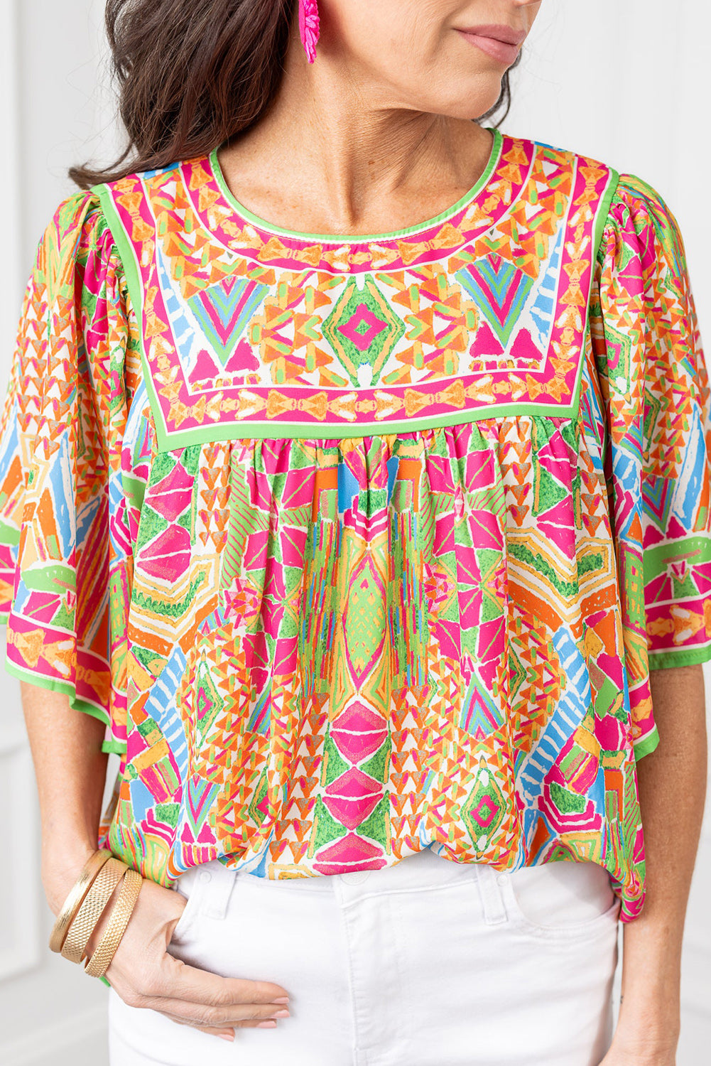 Chic orange geometric print babydoll blouse with bell sleeves