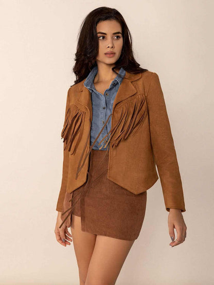 Tied tassel collared neck long sleeve jacket in brown worn over denim shirt, styled with a mini skirt.