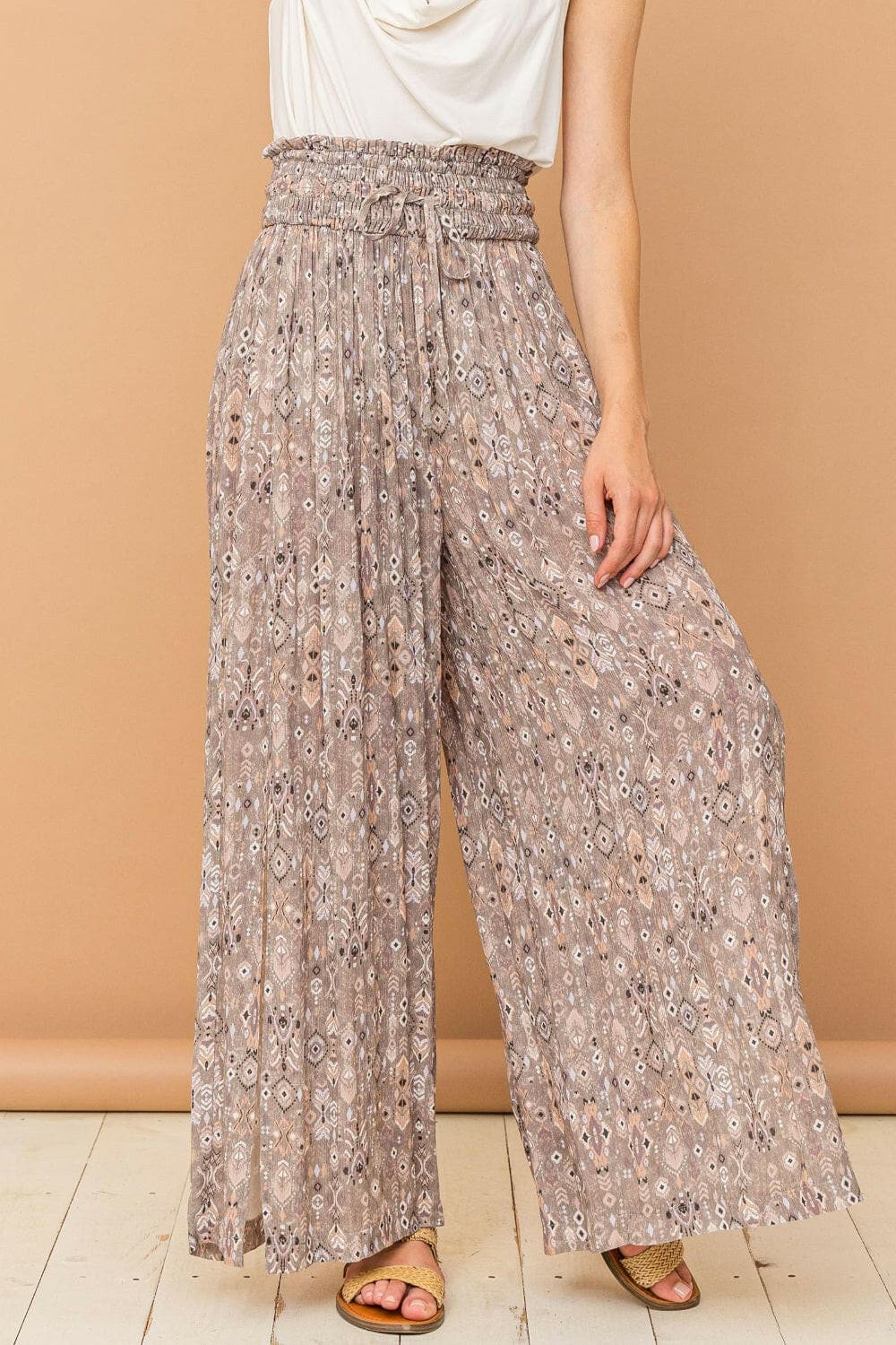 And The Why Printed Smocked Waist Slit Wide Leg PantsUpgrade Your Wardrobe with Style and Comfort
 The And The Why Printed Smocked Waist Slit Wide Leg Pants are a must-have addition to your fashion collection. These paLove Salve Printed Smocked Waist Slit Wide Leg Pantsusa