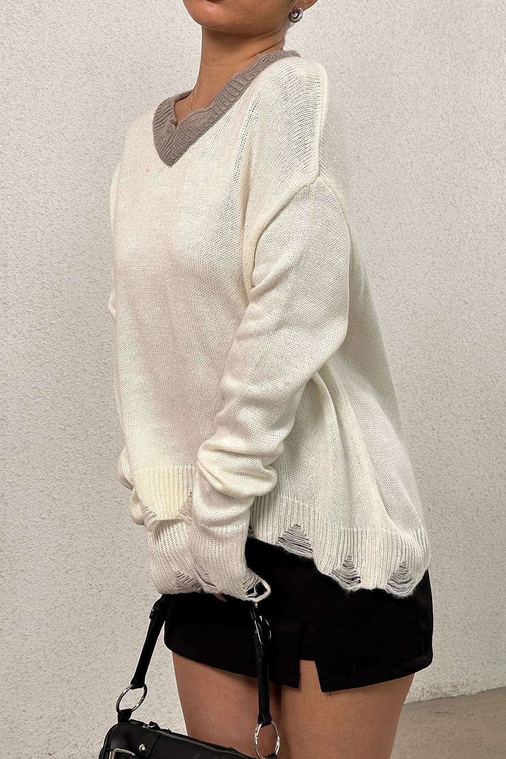 Distressed V-Neck Dropped Shoulder Sweater.