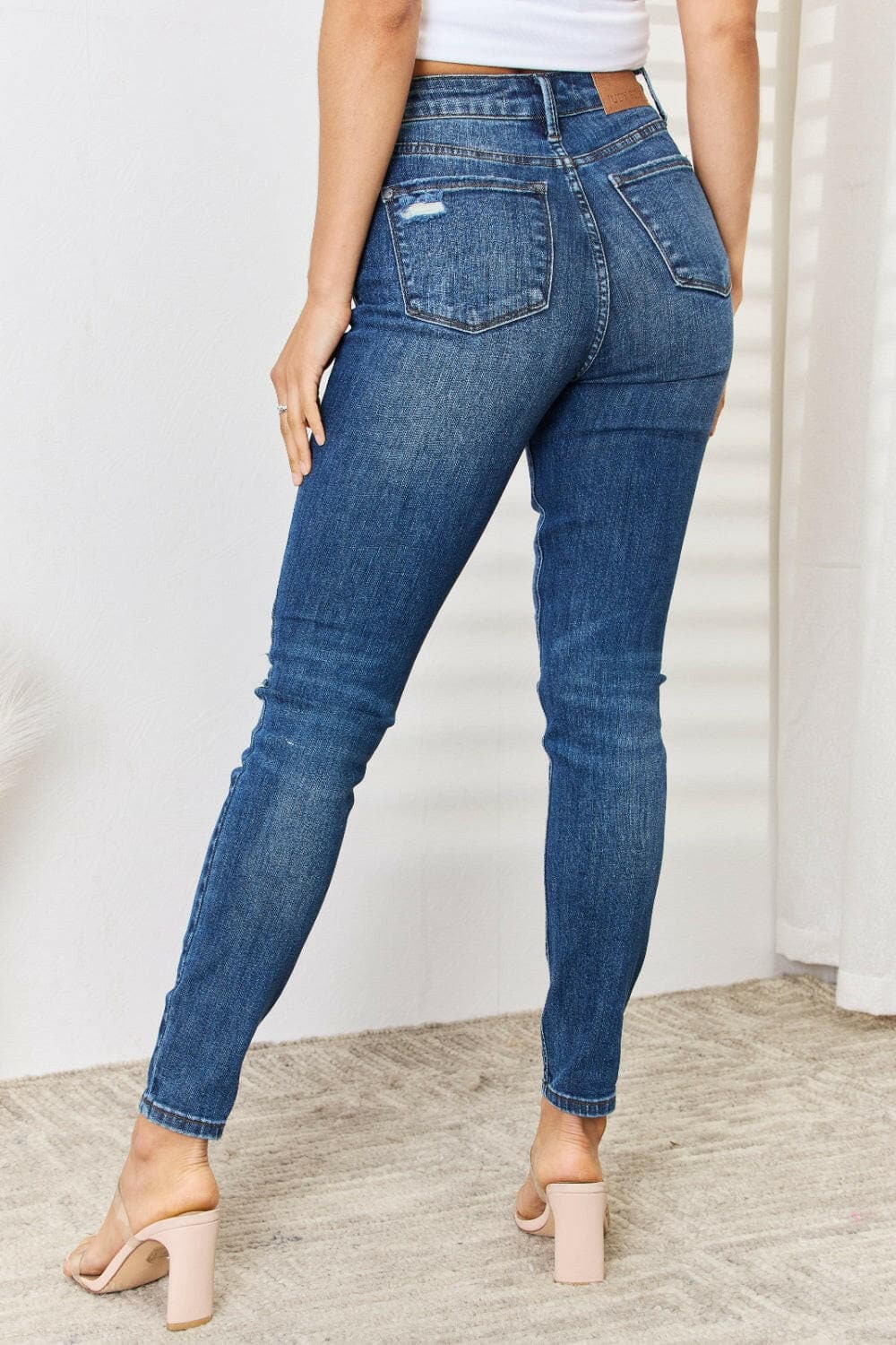 Judy Blue Full Size Mid Waist Distressed Slim Jeans.