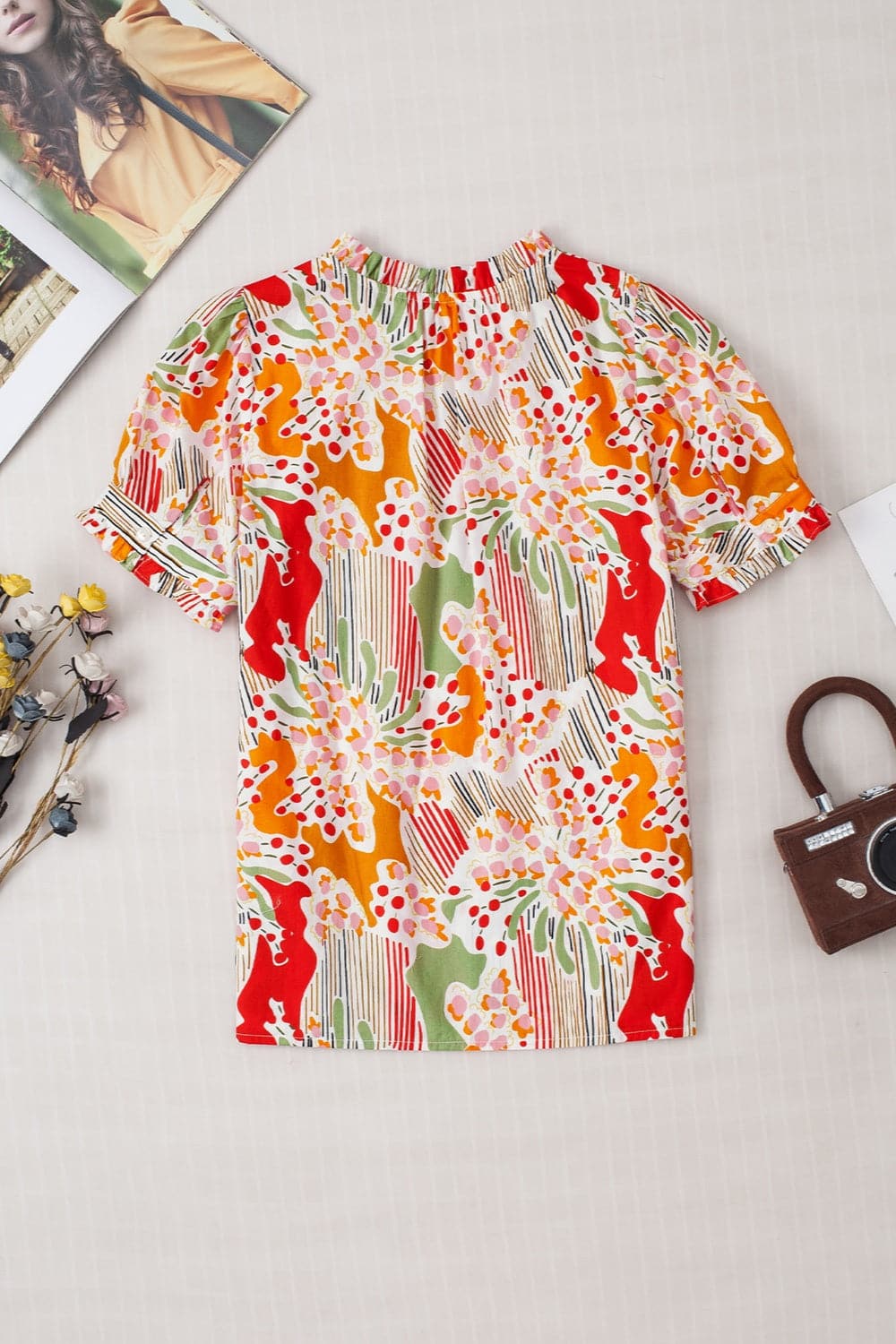 Printed Notched Short Sleeve Blouse.