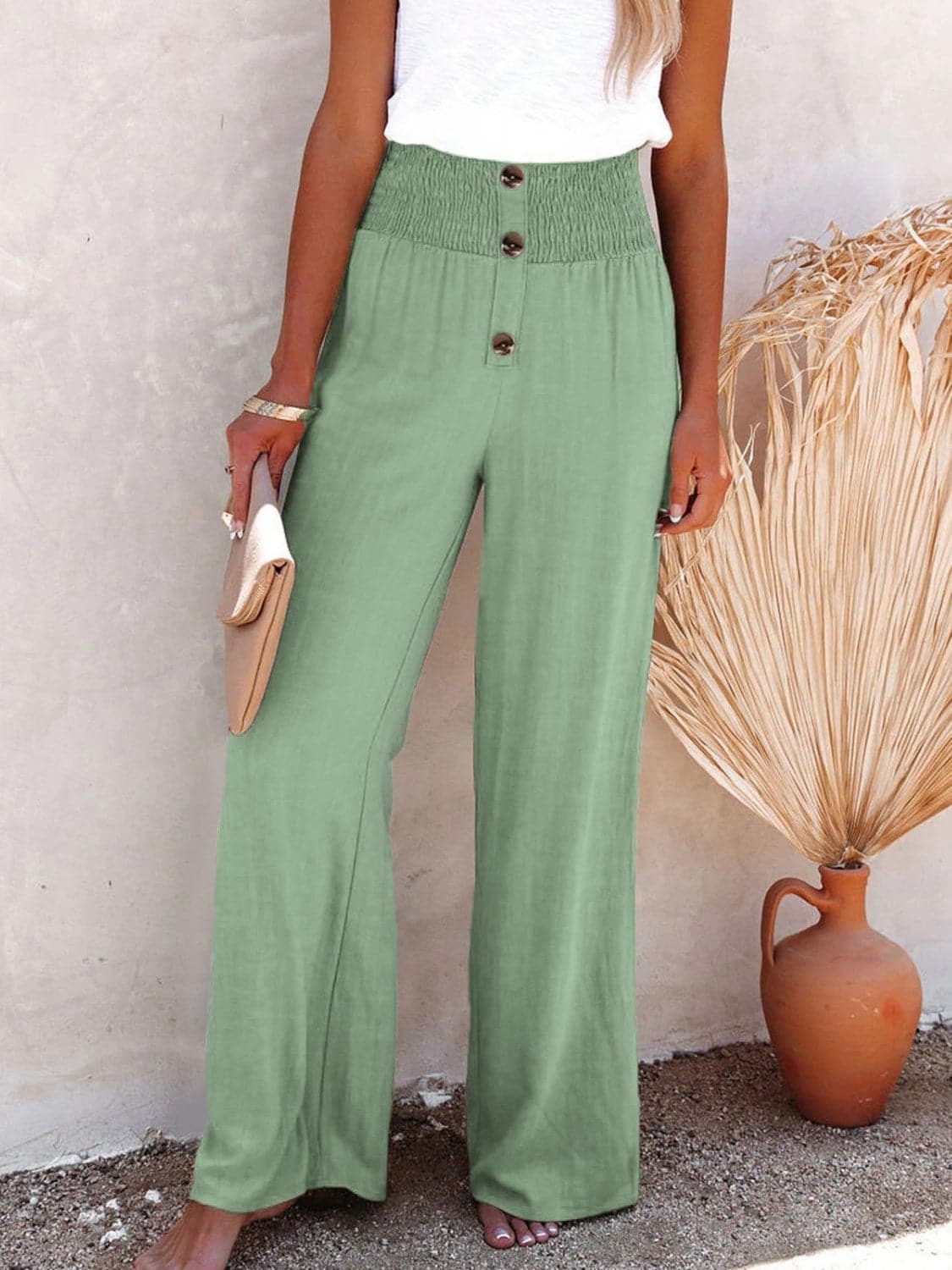 Chic high-waisted pants with decorative buttons