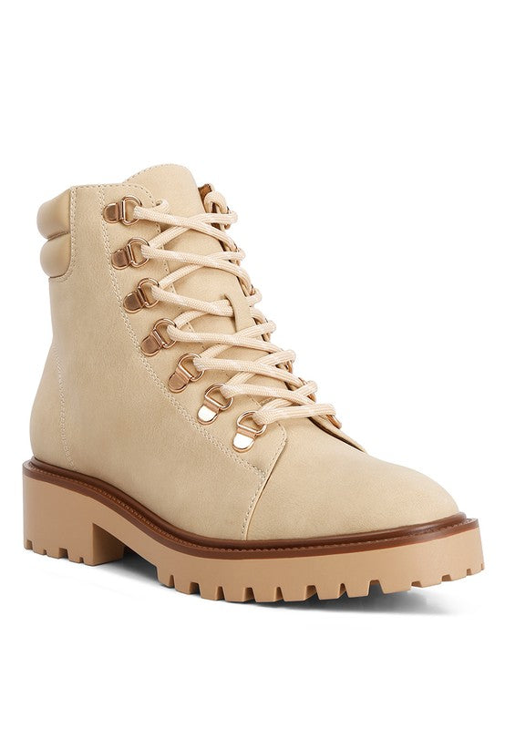 Beige lace-up boots with brown accents