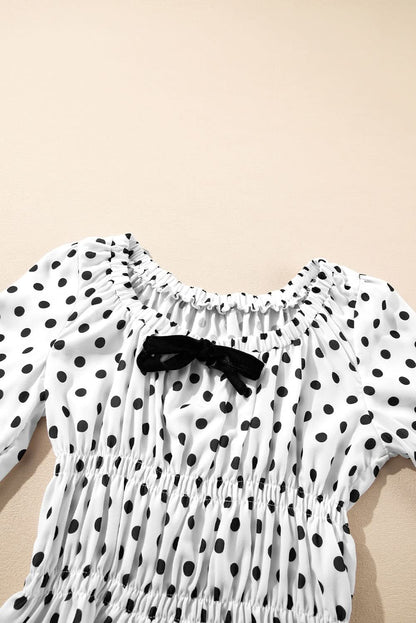 Chic Black Polka Dot Puff Sleeve Peplum Top with Bow Detail