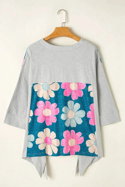 Floral V-neck blouse with three-quarter sleeves and high-low hem