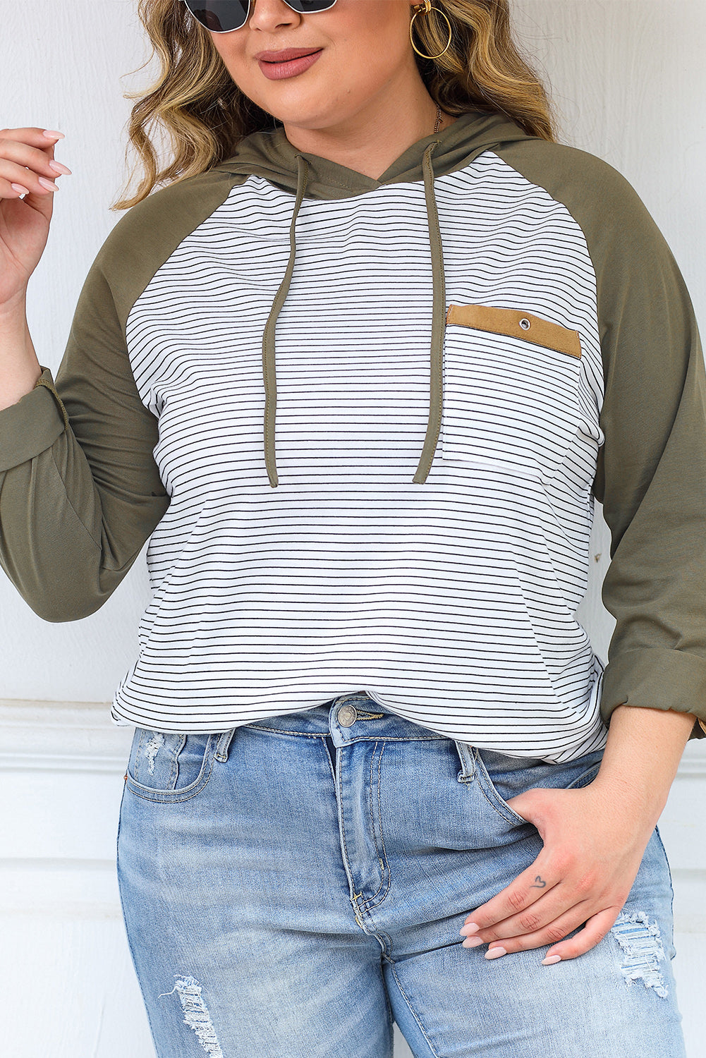 Green striped plus size hoodie with raglan sleeves and buttoned pocket