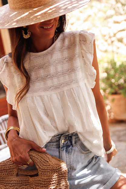 Lace-trimmed white flowy tank top with ruffled accents