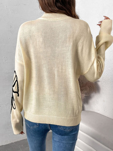 Cozy mock neck sweater with dropped shoulders and long sleeves