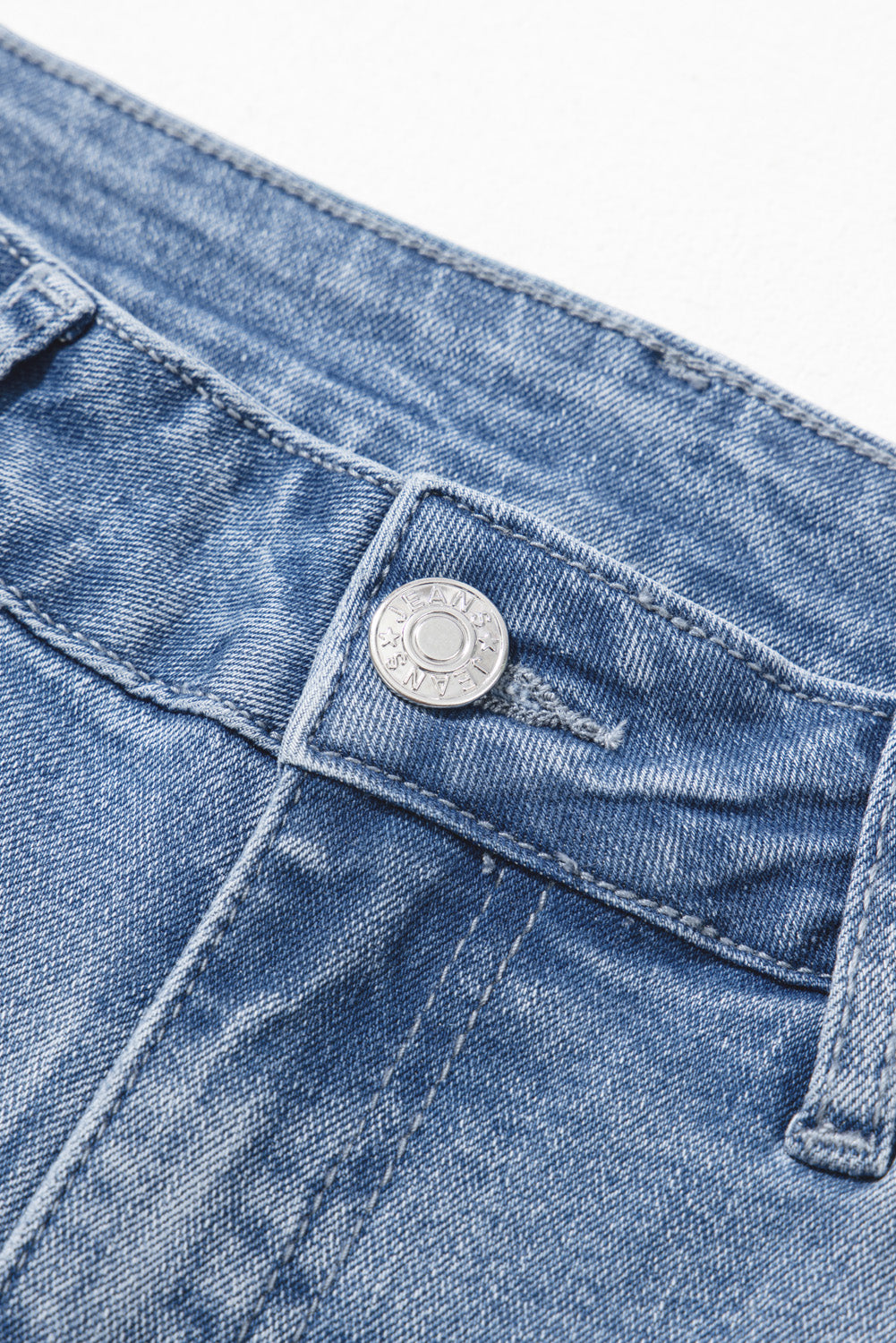 Vintage-inspired Beau Blue flared jeans with raw hem detailing