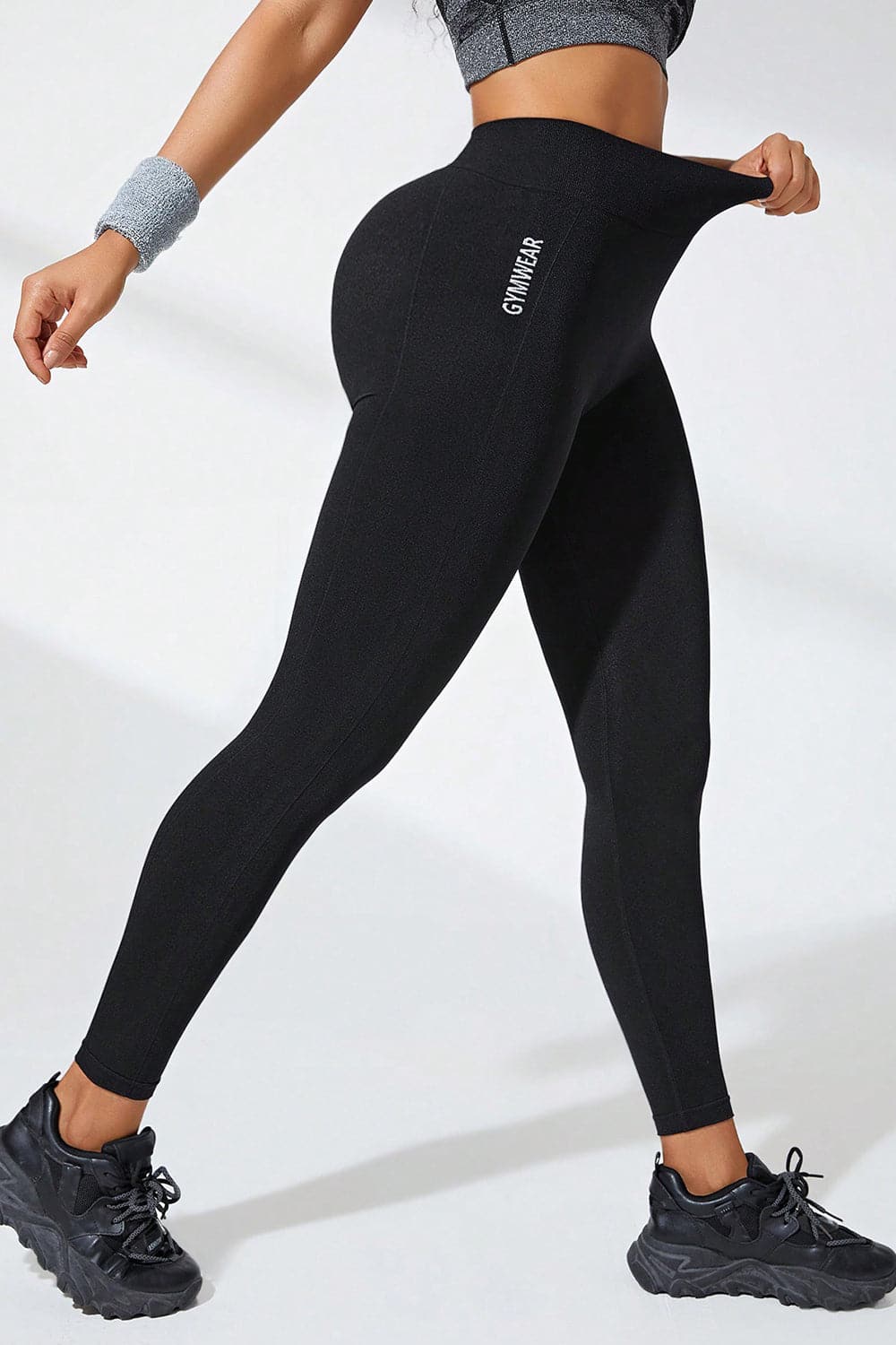 High-waisted active leggings in black showcasing stretchable comfort and flexibility.