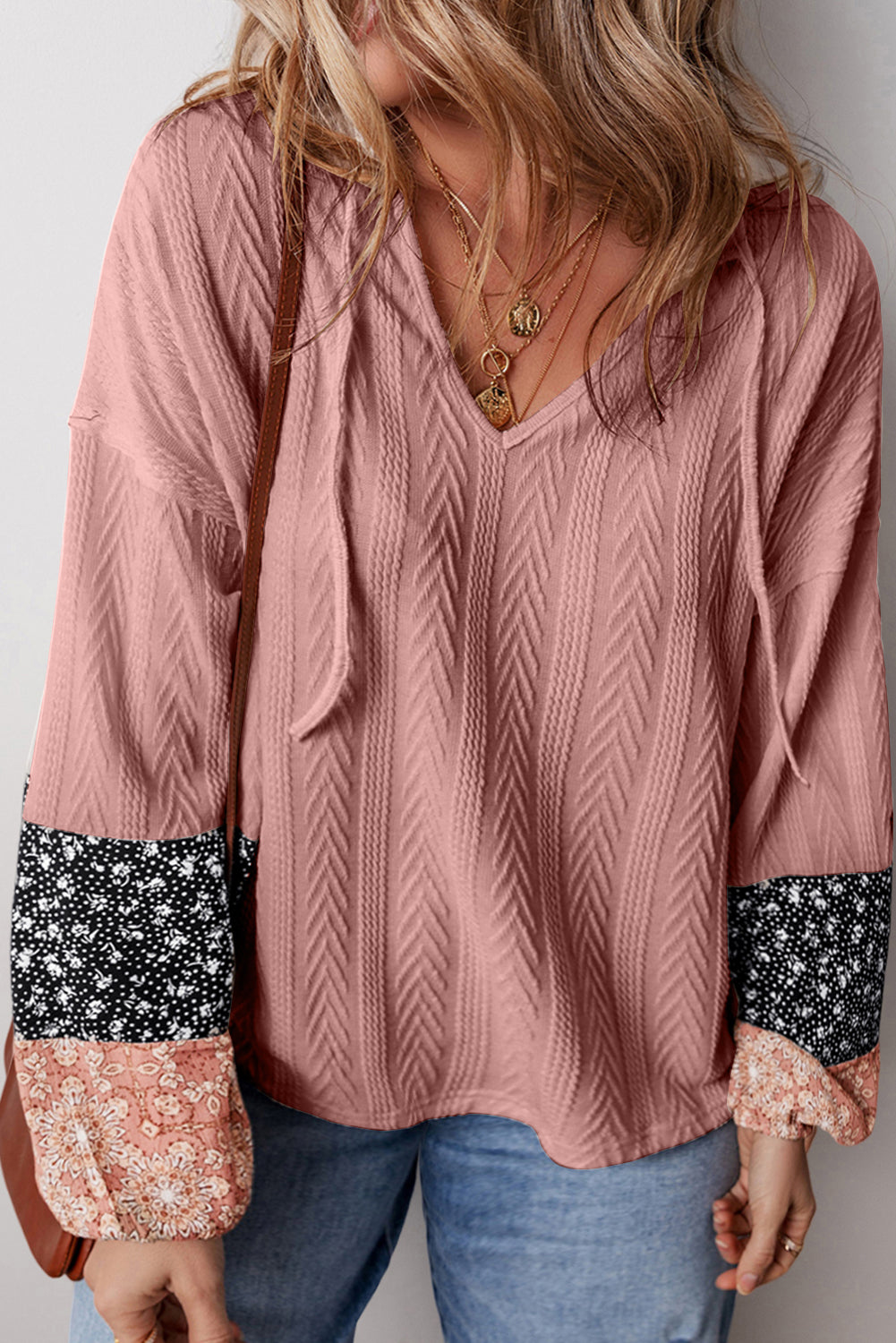 Dusty pink floral patchwork v-neck blouse with textured knit and drawstring detail