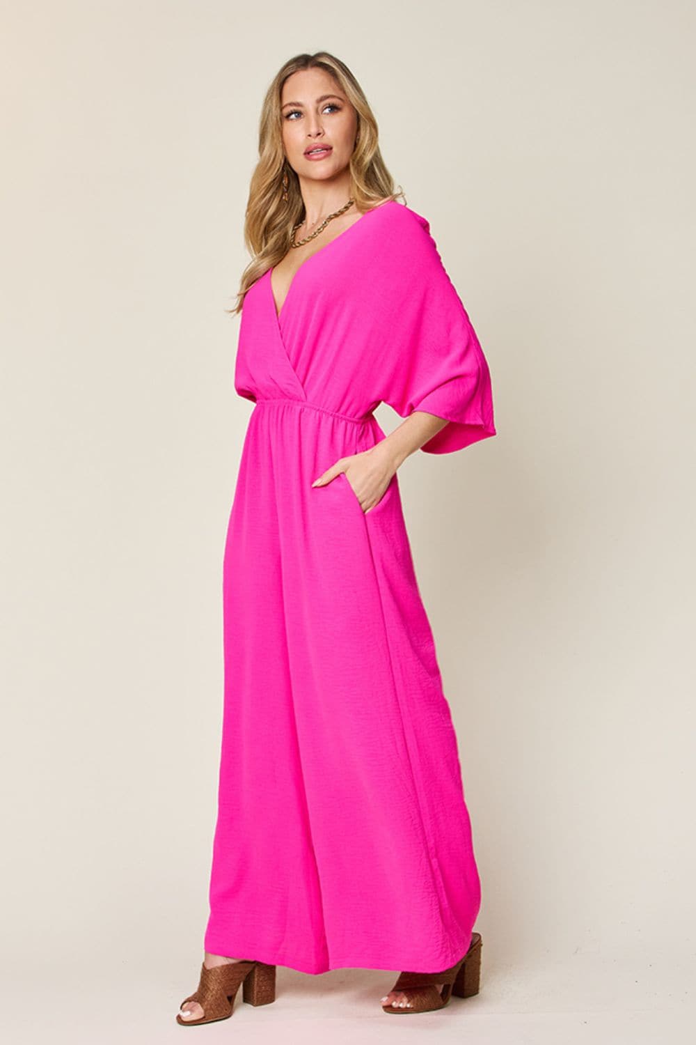 Double Take Full Size Surplice Wide Leg Jumpsuit with Pockets.