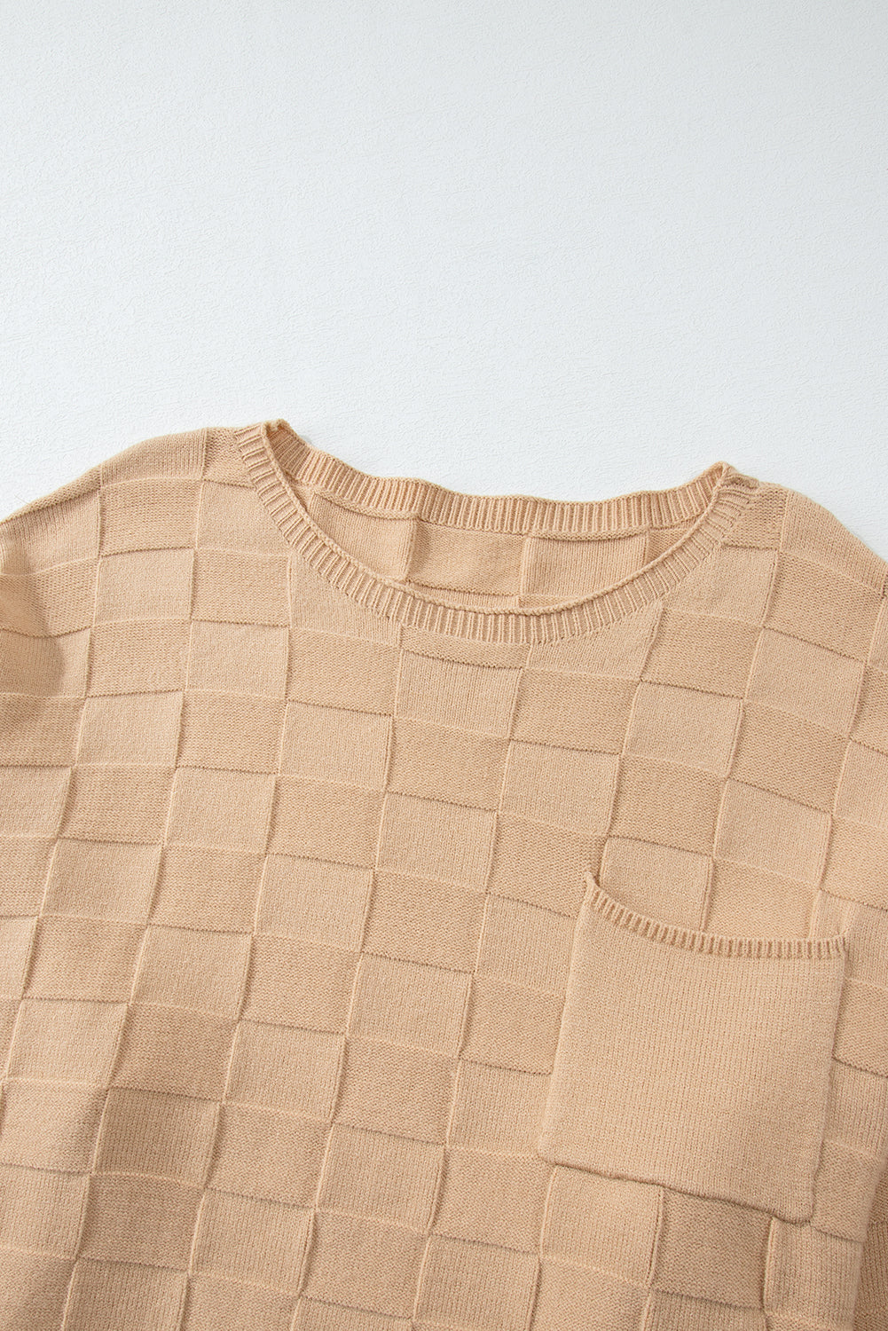 Cozy elegance: Light beige checkered textured knit sweater in plus sizes