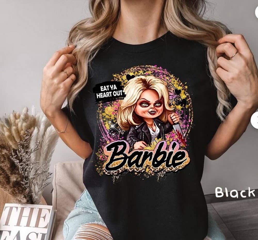 Tiffany “Eat Ya Heart Out Barbie” Tee – Halloween Horror Graphic Shirt Coco’s Tee Boutique