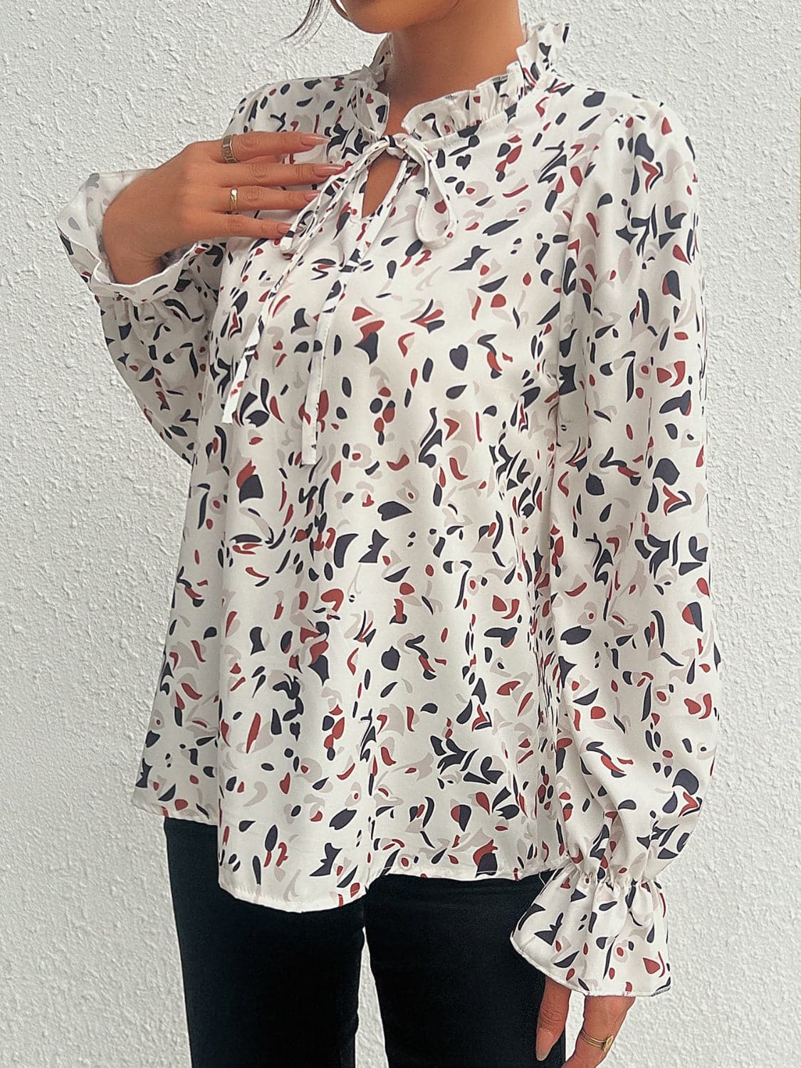 Ruffled Printed Tie Neck Long Sleeve Blouse.