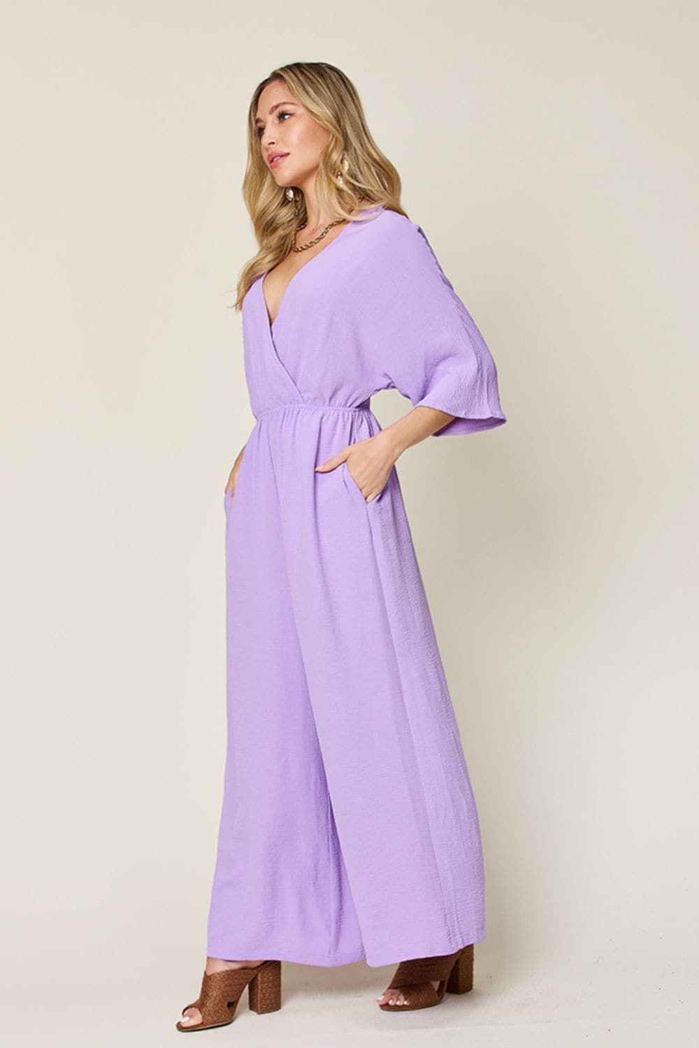 Double Take Full Size Surplice Wide Leg Jumpsuit with Pockets.